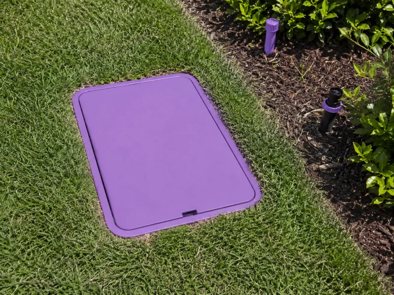 Reclaimed water irrigation using purple pipe and a marked valve box separated from potable lines